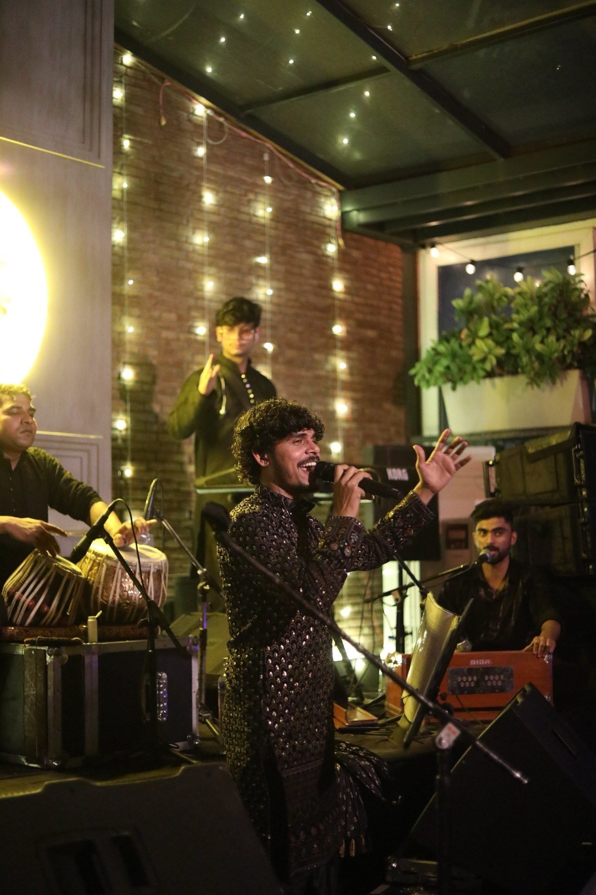 Satender Verma delivering a high-energy live stage performance